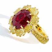 Lot 89 Property from an Important American Collection A Superb Ruby and Colored Diamond Ring Centering an oval-shaped ruby weighing 8.11 carats, framed by oval-shaped diamonds of yellow hue, the band further pavé-set with round diamonds of yellow hue Estimate $2.5/3.5 million Sold for $2,775,000