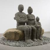 Boaz Vaadia B. 1951 The Family 2008 Bronze, blusestone and boulder 74 x 115 x 115 in. Ed. of 5   Israel-born artist Boaz Vaadia has enjoyed much acclaim since the 1980’s. His style has fully evolved into the recognizable forms of figurative sculpture created from layers of chiseled stone. His work reflects the eternal relationship between man and nature and encompasses a universal appeal. Vaadia’s stone, chiseled and stacked, arrowhead-like figures have a natural and mysterious quality of prehistoric artworks. This new body of work focuses on bust-style-portraiture using the same stylistic principles, processes and materials as his previous work. Vaadia’s sculptures are included in permanent collections of museums around the world including the Metropolitan Museum of Art, the Jewish Museum in New York, San Francisco Museum of Modern Art and the Tel-Aviv Museum.