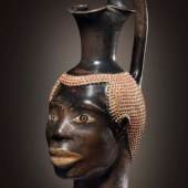 Oinochoe in the form of an African’s head. Class of Louvre H 62. Athens, c. 470 B.C. Terra cotta. H. 22 cm. Cahn, Switzerland
