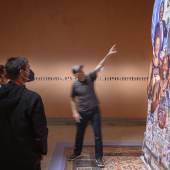 Walid Raad on his walkthrough in front of‘Frontispiece IIIa: The Peaces’, 2021Photo © Moritz Bernoully. Courtesy TBA21 Thyssen-Bornemisza Art Contemporary, © Walid Raad